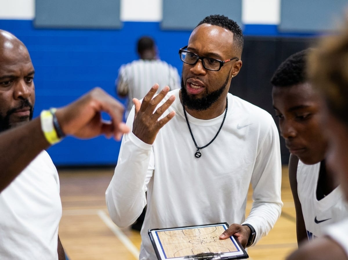 Coach with clipboard during timeout