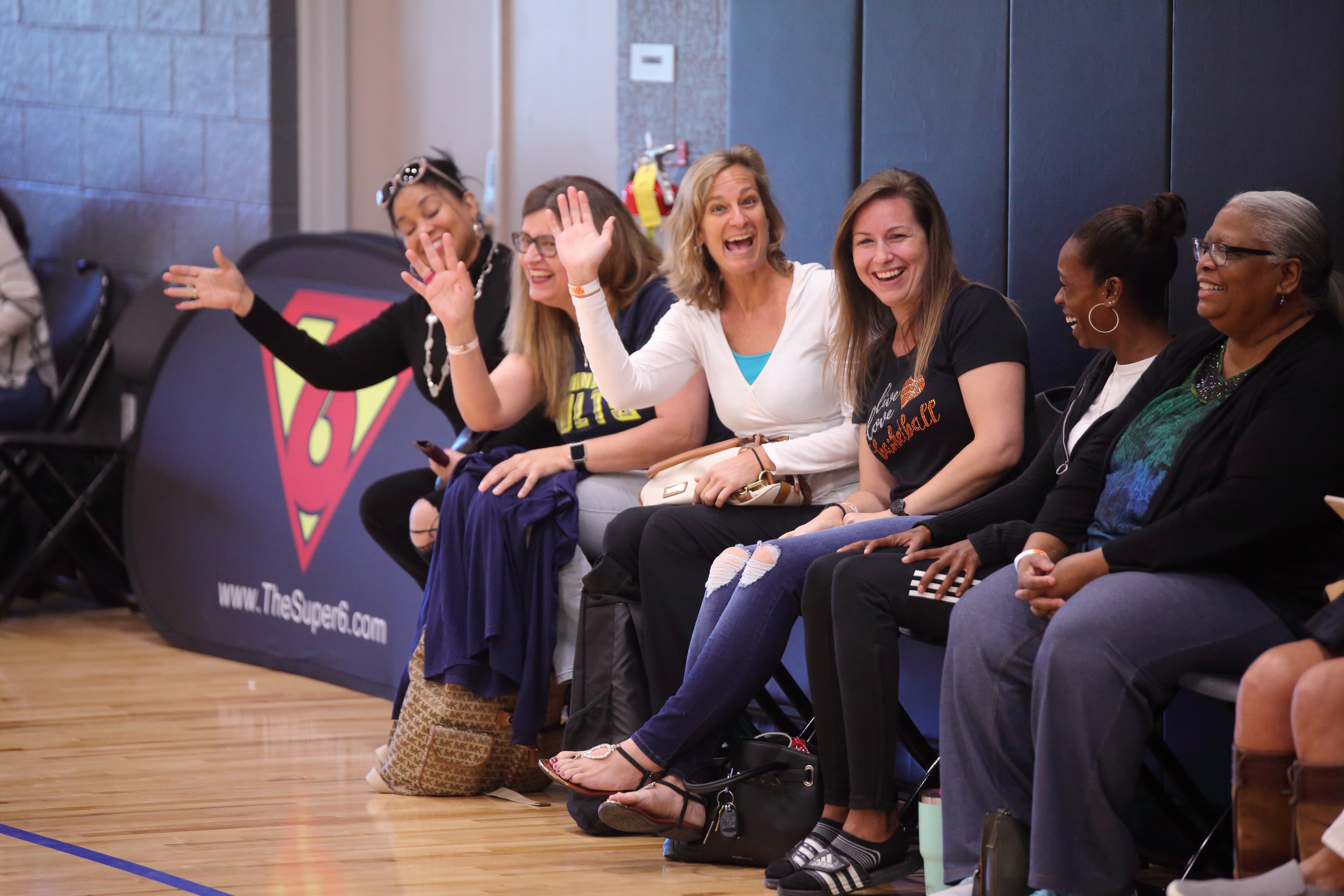 Family of spectators reacting on the bleachers