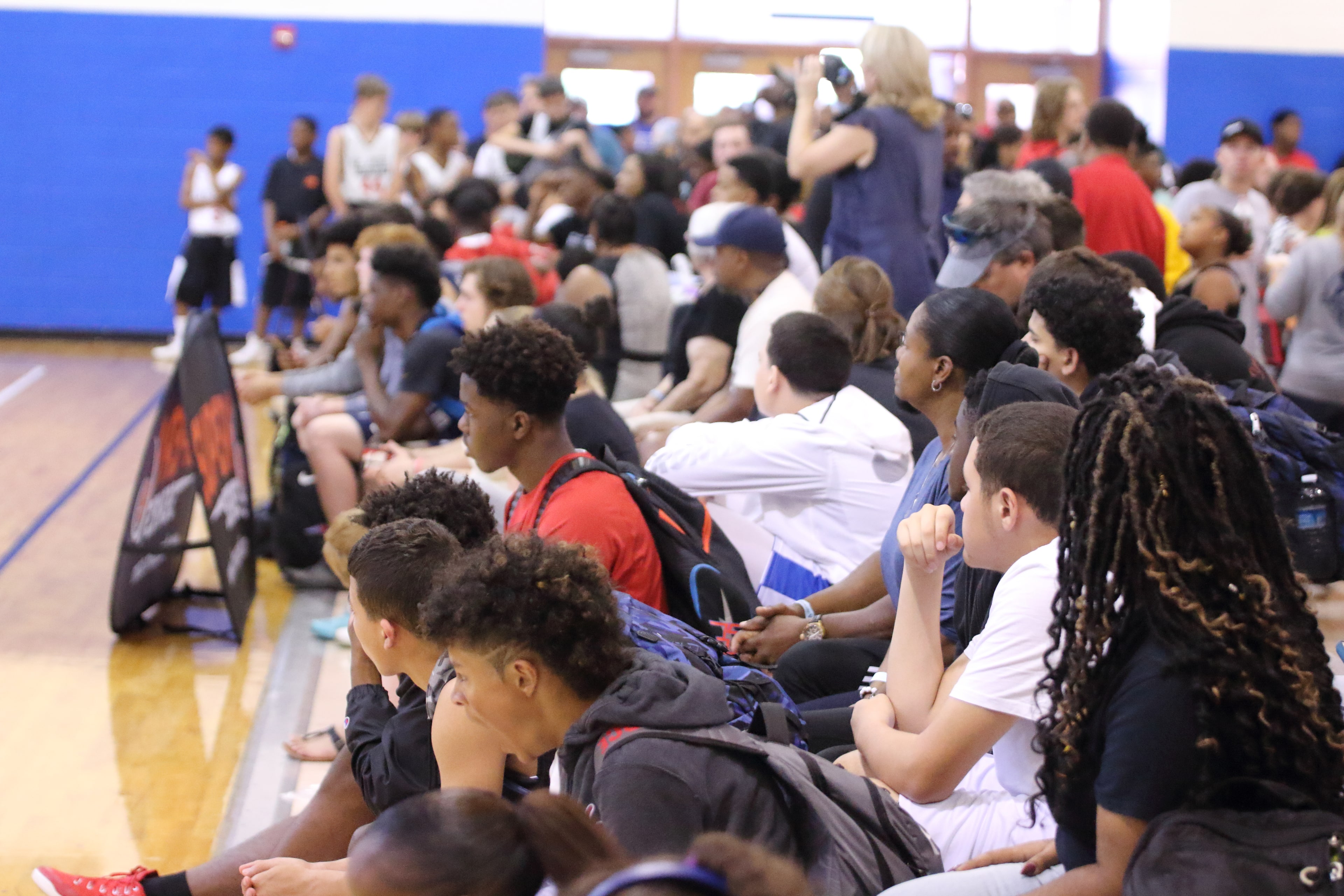 Crowded sideline mid-tournament
