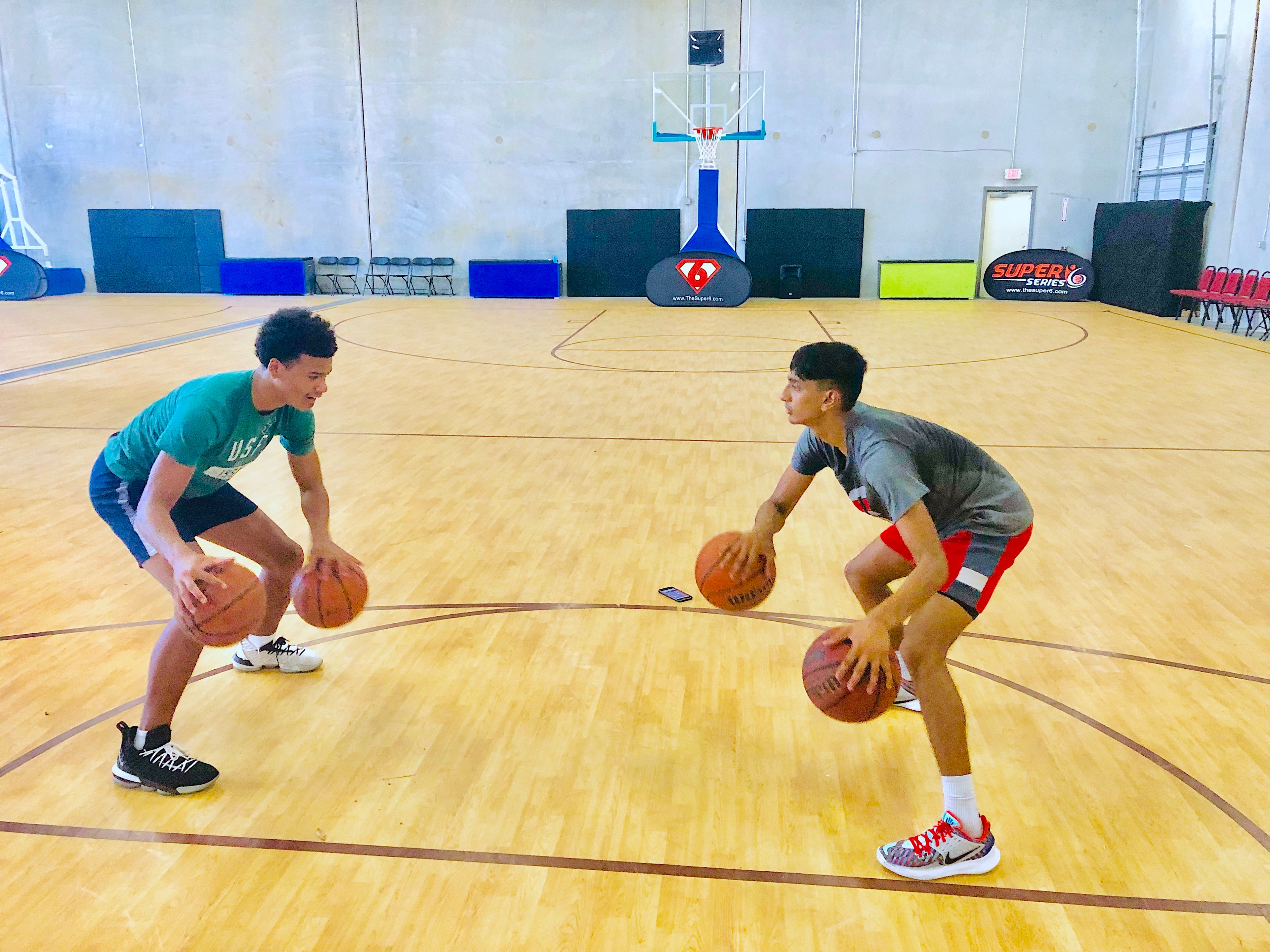 Two players training on the finished Super6 Series branded court