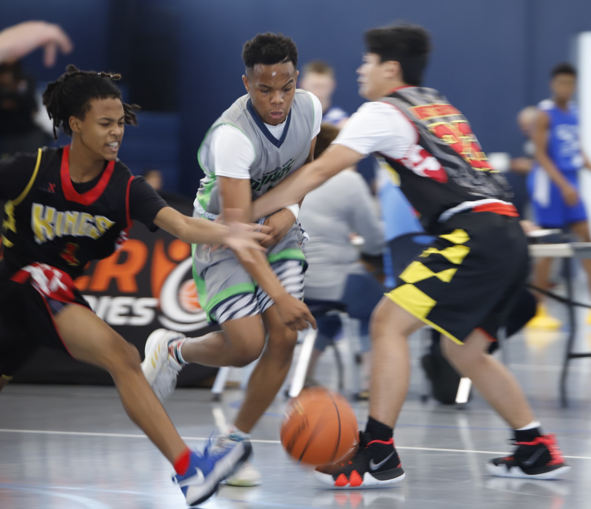 Intense three-player action during the Ivy League Showcase