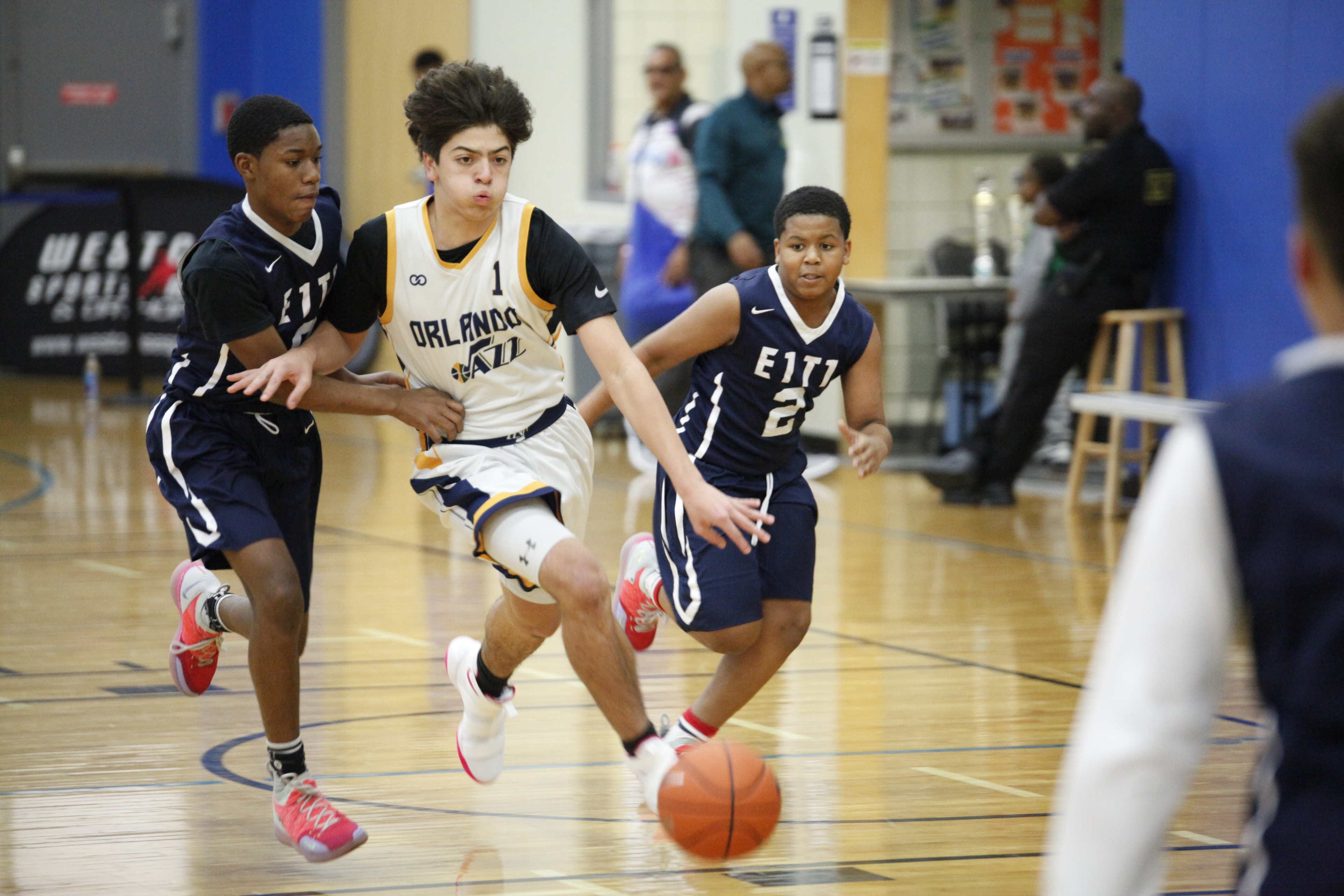 Orlando Jazz #1 driving past E1T1 defenders during Super6 tournament action