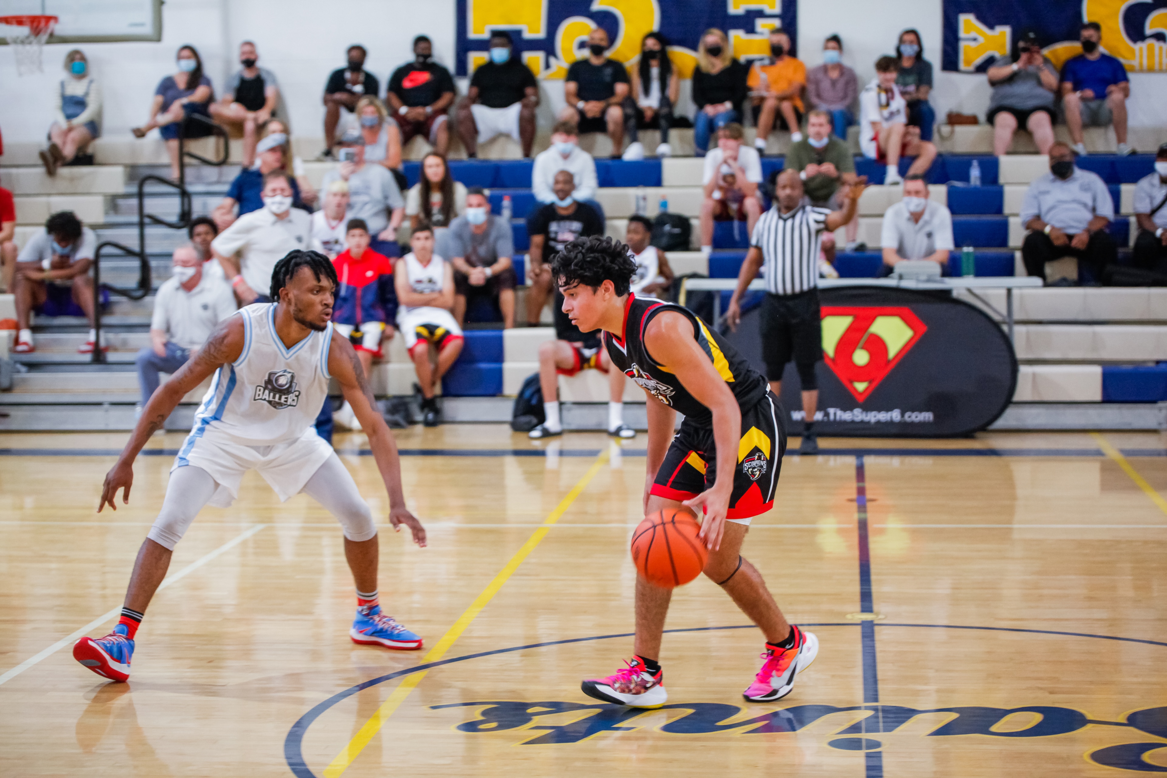 Youth basketball player driving to the hoop at a Super6 tournament in Florida